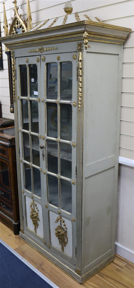 A painted and parcel gilt vitrine H.205cm